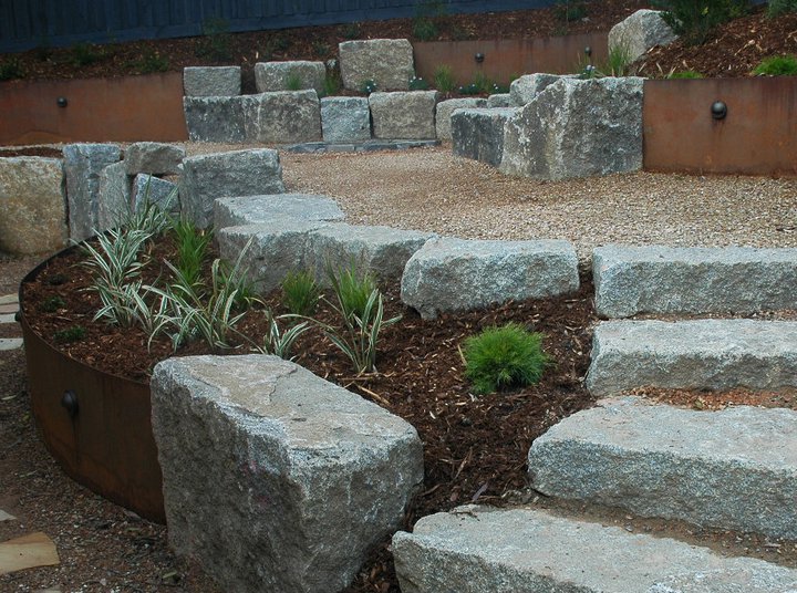 Drought-tolerant front garden in Hawthorn with structural grasses and native ground cover.