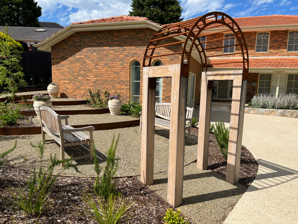 Heritage garden restoration in Hawthorn featuring clipped Buxus hedging and period-appropriate plantings.