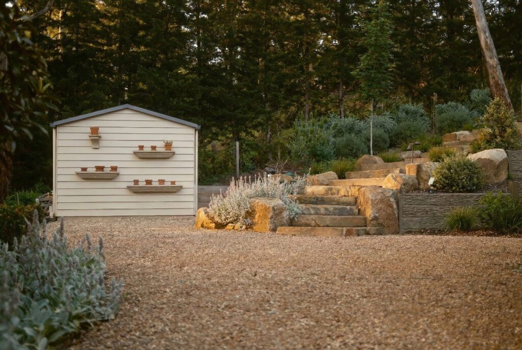 Award-winning landscape design at a Hawthorn period home featuring established hedging and stone paving by John French Landscape Design.