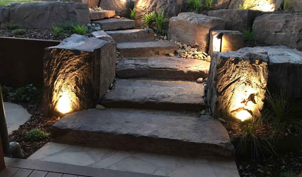 ompact courtyard garden near Glenferrie Road, Hawthorn, with travertine paving and feature lighting.
